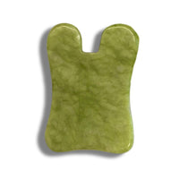 Gua Sha Anti-Ageing från Me Anima – ett grönt massageverktyg i jade designat för att ge en uppstramande effekt, stimulera blodcirkulationen och minska spänningar i ansikte och hals.