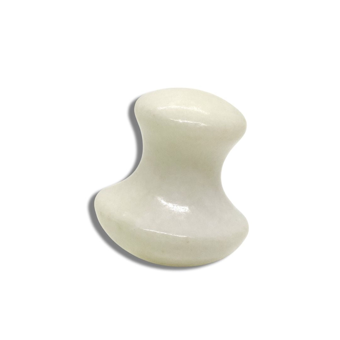 Gua Sha Mushroom i ljus jade. Ett rundat massageverktyg som används för ansiktsmassage för att minska spänningar, öka cirkulationen och ge huden en frisk och upplyft känsla.