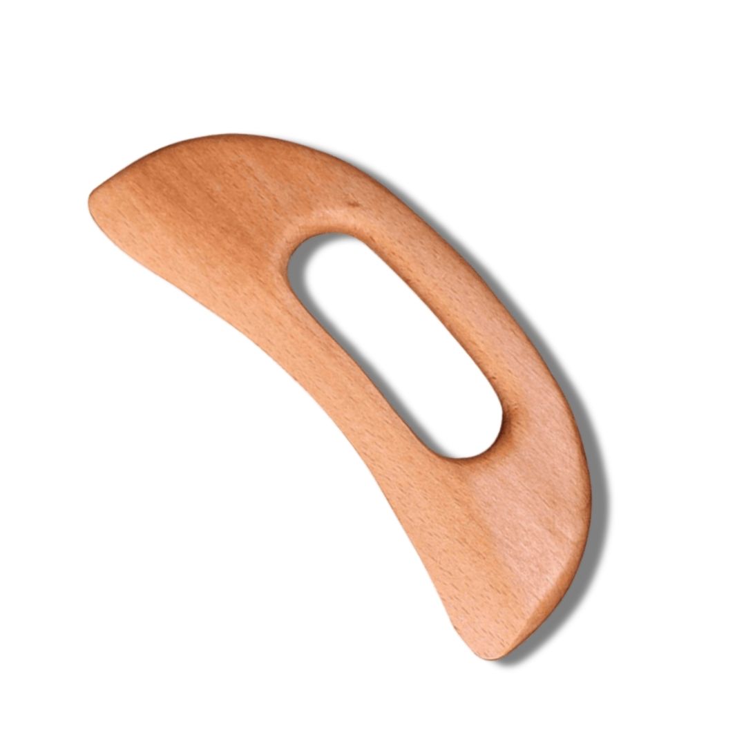 Gua Sha i bokträ från Me Anima – naturligt massageverktyg för kropp och ansikte som ökar cirkulationen, löser upp spänningar och ger en mjuk, avslappnad hud.