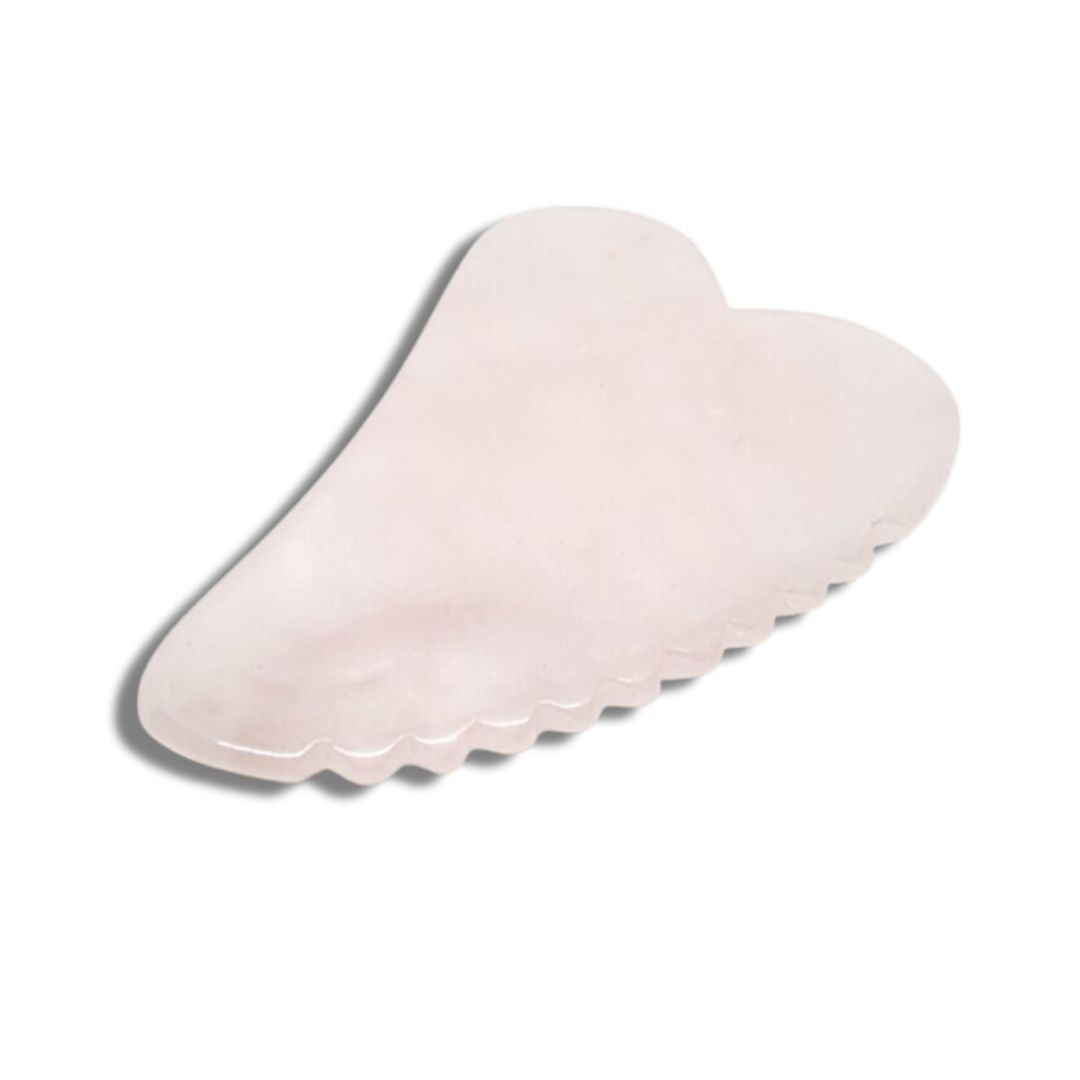 Gua Sha i rosenkvarts för kroppen från Me Anima – ett slätt och tandat massageverktyg som ökar blodcirkulationen, minskar spänningar och ger en avslappnande effekt vid kroppsmassage.